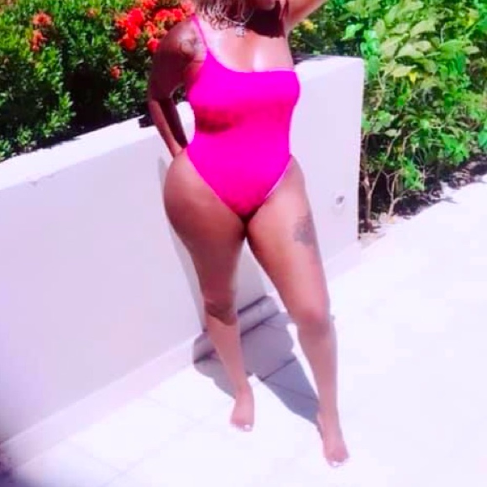 Pink one piece. Worn once in great condition.